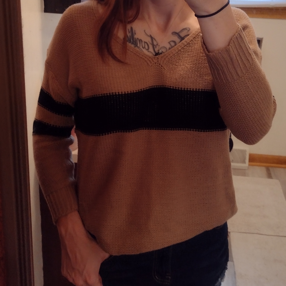 Cozy tan and navy blue sweater.